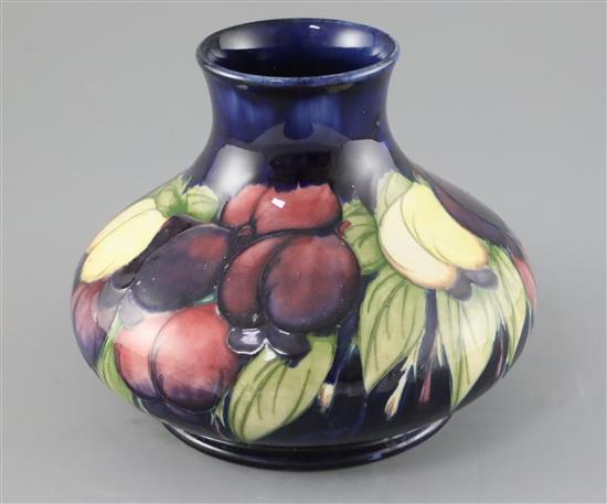 A Moorcroft wisteria squat baluster vase, c.1920-5, H.16cm